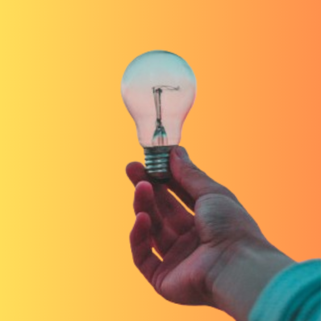 A close-up of a hand holding a lightbulb, set against an orange gradient background.

Credit: Photo by Diego PH on Unsplash.